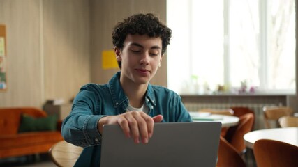 Happy satisfied Caucasian male boy guy student in school university academy finish end using laptop computer homework done complete internet e-learning studying online education technology knowledge - Powered by Adobe