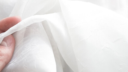 Romantic white veil background with airy layers and soft elegant textures.