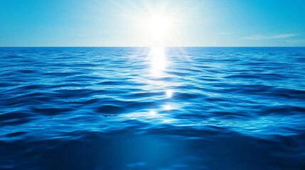 Obraz premium A serene ocean view under bright sunlight with glistening waves reflecting blue hues.