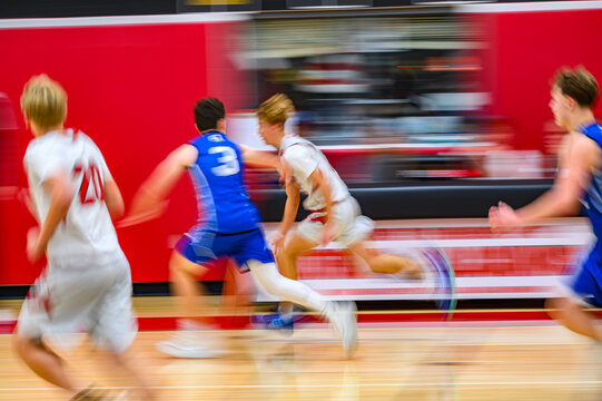 High School Basketball with motion blur showing the speed and movement of the young boys playing the game at Oxford HS in Upstate NY - Powered by Adobe