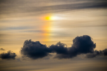 Colored halo over dark clouds.