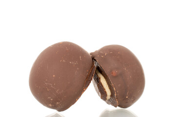 Several chocolate candies, close-up, isolated on a white background.