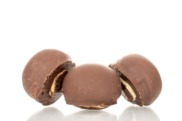Several chocolate candies, close-up, isolated on a white background.