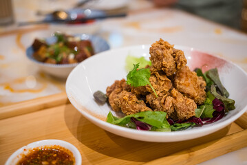 Crispy fried chicken dish served in restaurant