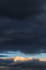 Obraz premium Storm cloudy dramatic sky with dark rain grey cumulus cloud and blue sky background texture, thunderstorm, heaven