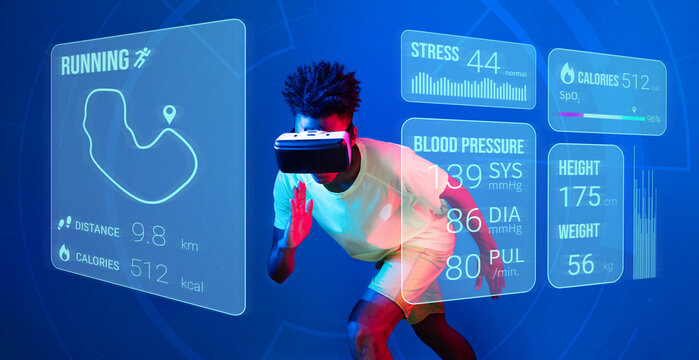 African man jogging or using augmented reality goggle and artificial intelligence practicing and training. Male model with shirt doing running posture and looking at hologram. Technology. Ingenuity.