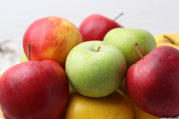 Pile of different whole ripe apples, closeup