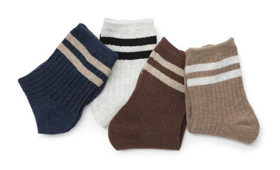 Pairs of folded soft socks isolated on white, top view