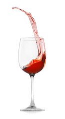 Rose wine splashing in glass on white background