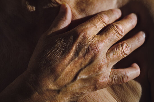 Close-Up of Senior Man's Hand Highlighting Wrinkles