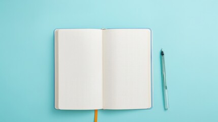 Blank Open Notebook on a Solid Blue Background with a Pen Ready for Writing, Sketching, or Taking Notes for Creative Purposes and Planning Activities