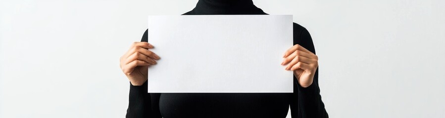Naklejka premium Person holding blank sheet on white.