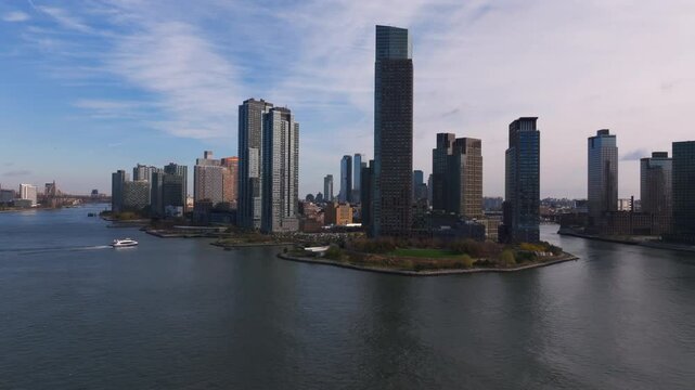 Gotham Point, Long Island City, Queens with modern residential architecture along the East River, framed by the stunning skyline of New York City