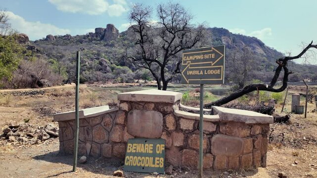 Instruction signs at the Matobo National Park is in southwest Zimbabwe on a clear sunny day