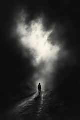 Fototapeta premium Solitary figure walks path, bright mist ahead.