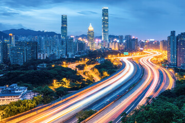 Fototapeta premium Night city skyline with light trails and skyscrapers