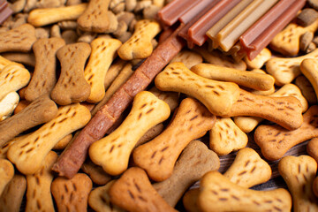 Top view of different types of dog food, dried treats.