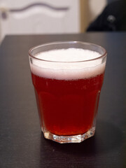glass of fruit beer on table