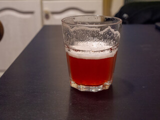 glass of fruit beer on table
