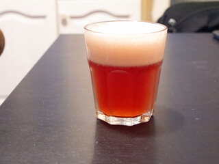 glass of fruit beer on table