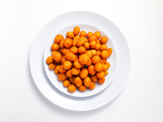 Spicy pilus served on a white plate, isolated on a white background. Perfect for a snack