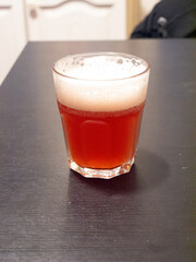 glass of fruit beer on table