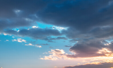 Sunset sky background. Beautiful bright sunset sky with clouds.