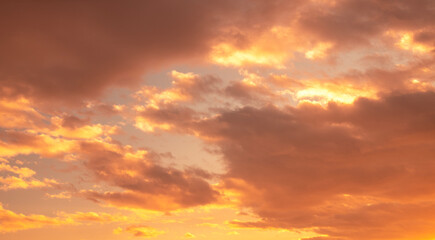 Sunset sky background. Beautiful bright sunset sky with clouds.