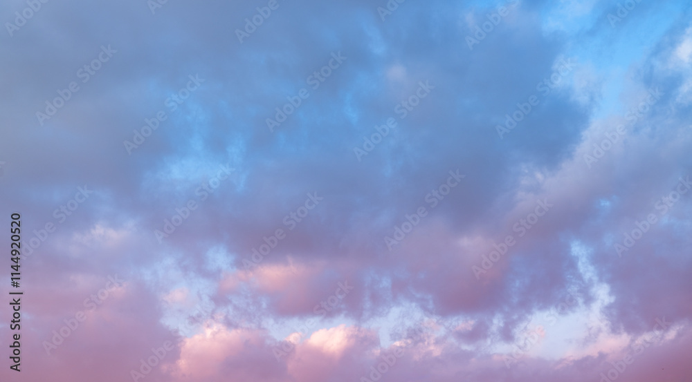 Wall mural beautiful tender sunrise sky with clouds. sky background.