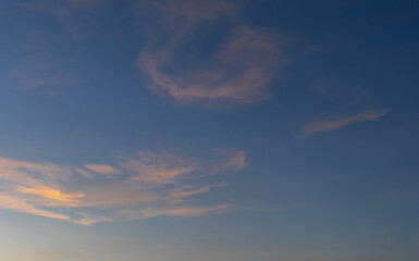 Sunset sky background. Beautiful bright sunset sky with clouds.