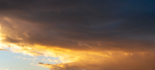 Fototapeta premium Sunset sky background. Beautiful bright sunset sky with clouds.
