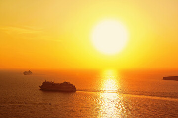 Tourist ships against the backdrop of sunset in the Aegean sea.