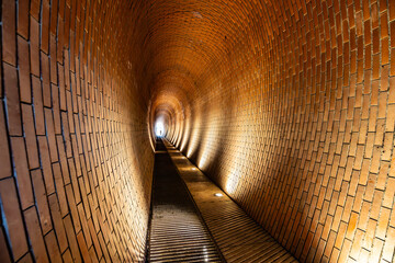 The Deer Moat Pedestrian Tunnel near Prague Castle features distinctive brick architecture,...
