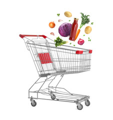Groceries falling into shopping cart on white background