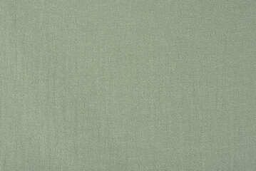 Green texture of dyed fabric as a background.