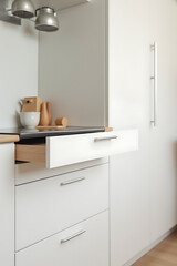 Fototapeta premium The kitchen has a white drawer and countertop with home furniture pieces that follow a minimalist design aesthetic._00003_