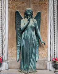 Monument of old angel in Catholic cemetery.