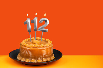 Birthday candle number 112 - Cake with dulce de leche frosting.