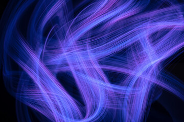 Intertwining lines of light on a black background