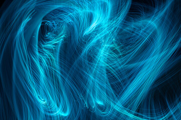 Fototapeta premium Intertwining lines of light on a black background
