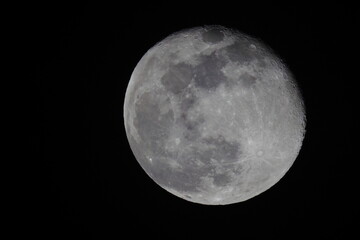 Full moon in black night sky. 