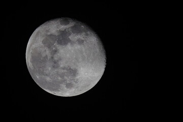 Full moon in black night sky. 