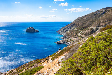 Fototapeta premium Walking path along sea and high cliffs to Panagia Hozoviotissa monastery, Amorgos island, Cyclades, Greece