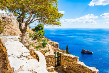 Walking path along sea and high cliffs to Panagia Hozoviotissa monastery, Amorgos island, Cyclades,...