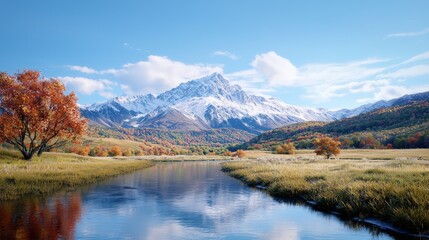 Fototapeta premium Snowy mountain peak rising above a winding river valley with autumn trees and reflections.