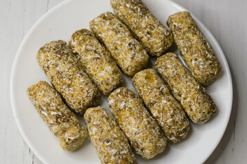 Delicious homemade sugar-free energy bars on a plate. Diet and healthy eating concept