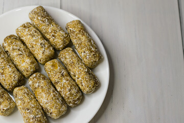 Delicious homemade sugar-free energy bars on a plate. Diet and healthy eating concept