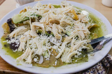 Chilaquiles with green sauce. Authentic breakfast from Mexico