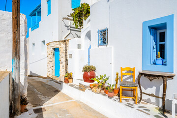 Fototapeta premium Narrow alley in Tholaria village with typical Greek architecture, Amorgos island, Cyclades, Greece
