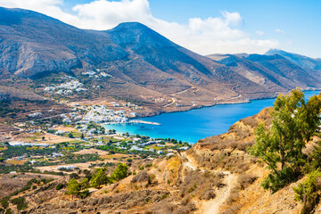 View of trekking path from Tholaria village to Aigiali sea bay and mountains in distance, Amorgos...
